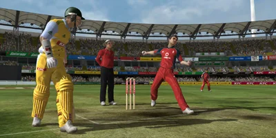 A bowler, mid-throw, being watched by an opposing player