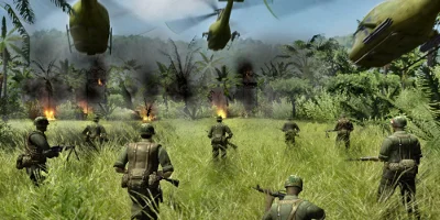 Infantry advance as helicopters fly low overhead
