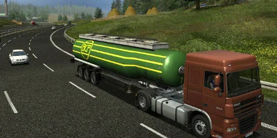 brown and green tanker passing bt