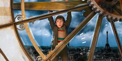 Hugo Hanging from Clock