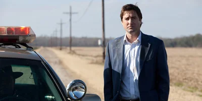 Luke Wilson Stood Next to Police Car