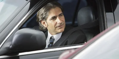 Man in Car, With Window Down