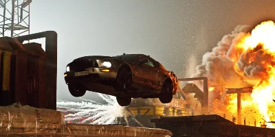 Car in the Air and Explosion in the Background