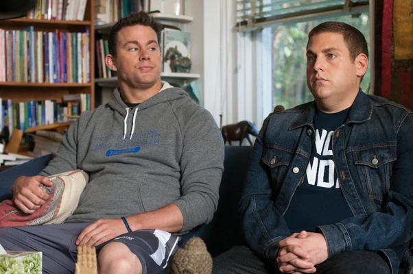 Schmidt and Jenko sat on a couch
